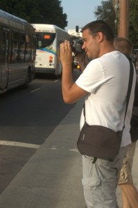 European male tourist takes a photo of LA Grand Park f