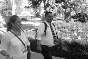 hispanics walk down Hill st in downtown LA