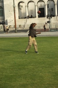 man plays catch for football