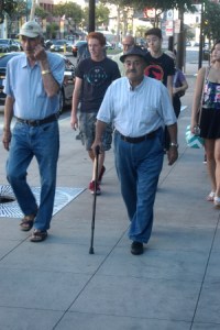 Proud gent strolls with felling and troops of followers