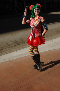 woman in sexy clown attrire poses with smile Slutwalk LA 2016