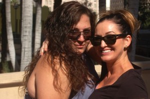 2 attractive girls smile at slutwalk LA photo
