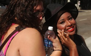 goirl on smart phone smiling at slutwalk LA