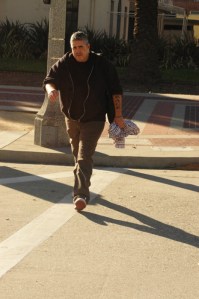 hisopanice middle age male quickly crosses street near downtown Pasadena CA