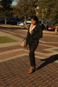 attractive hispanioc twenty somehting slowly strolls down the strett Pasaadena CA