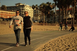 middle aged wghite walk along pedestrain way at 27 Santa Monic beach 2015