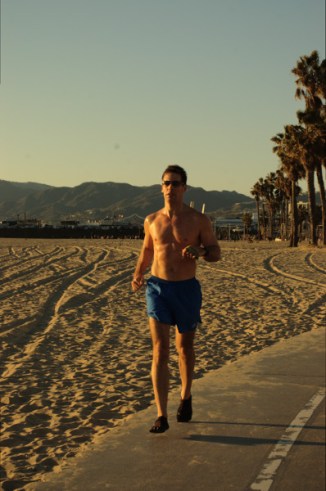 man in blus trucks joggs at beach Santa Monica CA Nov 2015