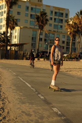 teen female rides skateboard at Sant Moinca CA Nov 15