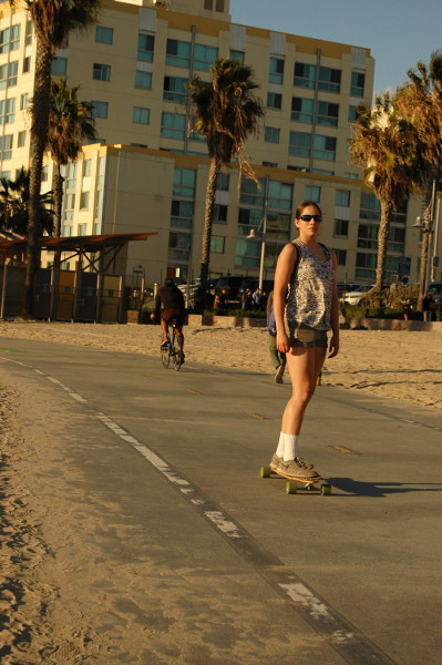 teen female rides skateboard at Sant Moinca CA Nov 15