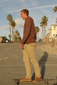 20 something skateboard with a big smile