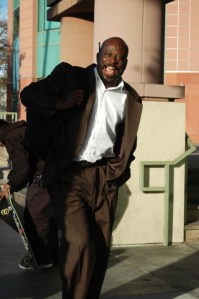 happy Africian Amercian man in suit with big smile