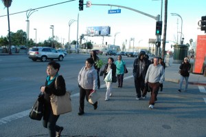 southern california people cross street near cuty goverment