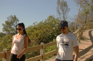 attractive twenty somehting couple walk in Griffith Park, LA, CA