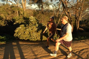 2 older white males briskly walk Griffith Park, LA, CA