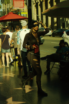 fmelae dressed as catwoan in black leather