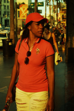 attractive 2o somehting africcian American female in red polo