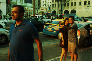 young Asian American couple take selfie
