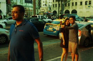 young Asian American couple take selfie