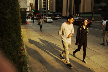 vibrant 220 somethings man & woman laugh on flower St