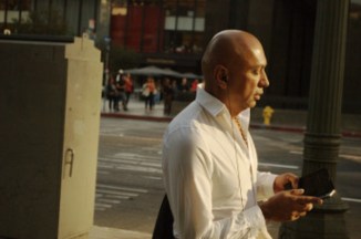 bald handsome 50 year man on I phone text