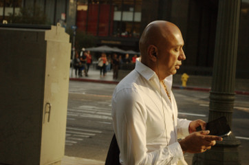 bald handsome 50 year man on I phone text