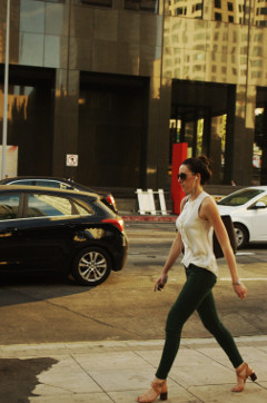 sexy tall 20 something female walks down Flower St