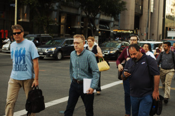 street scene crowd cross street on Flower St