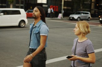 attractive blonde look at man with long hair crossing intersection