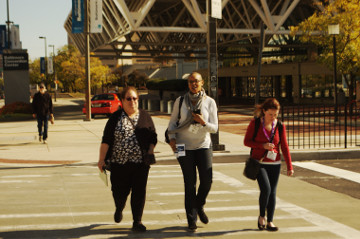 Baltimore 31 Oct 16 inner harbor young women cross street