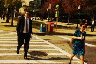 Baltimore 31 Oct 16 inner harbor man in suit and female cross the street