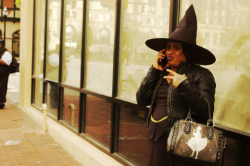 Baltimore 31 Oct 16 inner harbor attractive African Amercian female in witch custume