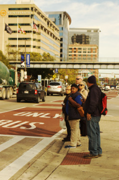 Baltimore 31 Oct 16 inner harbor crowd waits to cross the street