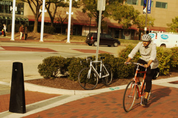 Baltimore 31 Oct 16 inner harbor man biking